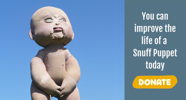 Photo of 7 foot tall Baby puppet looking up into a blue sky. Text reads: You can improve the life a Snuff Puppet today! Donate.