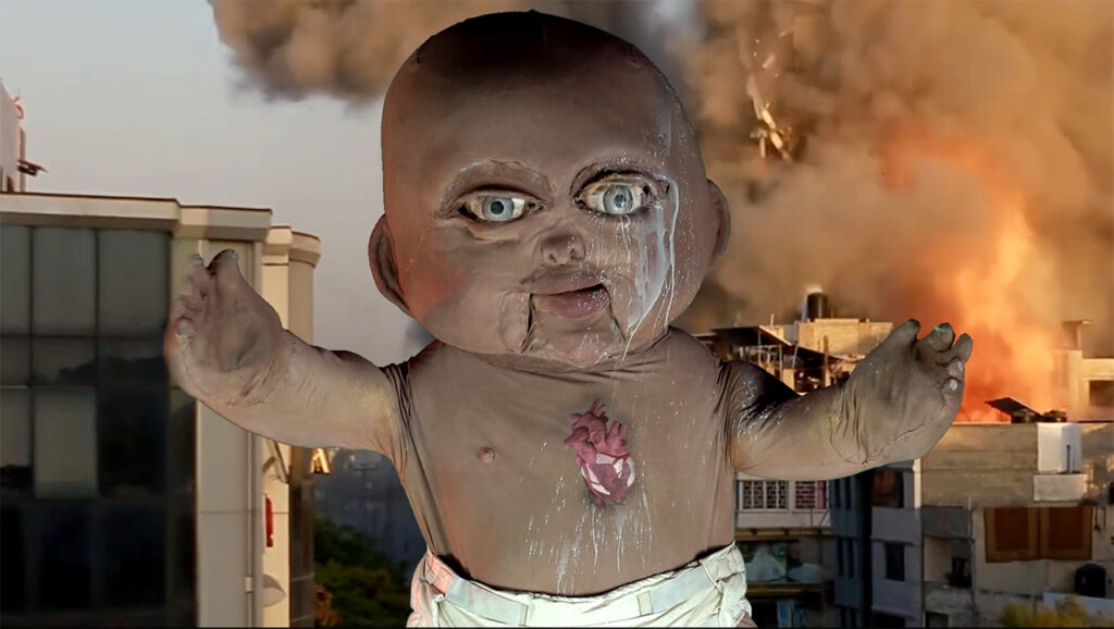 Baby puppet stands in front of a building blowing up